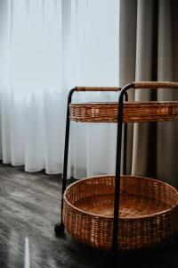 two baskets sitting on the floor next to a window at Excellentas Apartments Hannover in Hannover