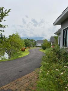 a road leading to a house and a house at Ban 5 Rai Pool Villa in Chiang Mai