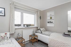 A bed or beds in a room at Guesthouse Vatnsholt