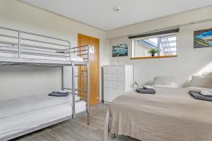 A bed or beds in a room at Guesthouse Vatnsholt