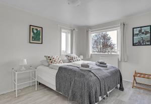 A bed or beds in a room at Guesthouse Vatnsholt