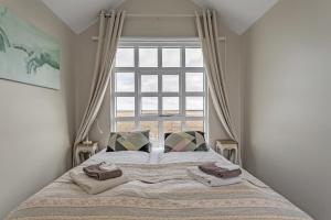 A bed or beds in a room at Guesthouse Vatnsholt