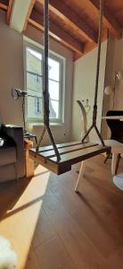 a living room with a swing in a room at -La Maison Balancoire - Parking privé offert - Coeur historique -La Clef de Honfleur in Honfleur