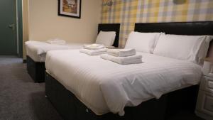 Ліжко або ліжка в номері Greenland's Inn