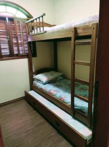 a couple of bunk beds in a room at Aconchego de Regina in Tiradentes