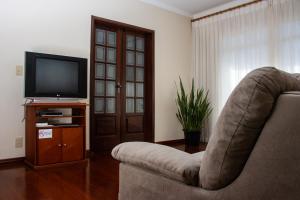 TV a/nebo společenská místnost v ubytování Apart Hotel Água Limpa