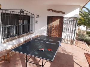 Stolní tenis v ubytování CASA RURAL LA CERCA nebo okolí