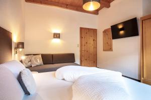 A bed or beds in a room at Vizensn Living