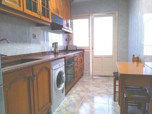 A kitchen or kitchenette at Apartamentos La Rosa - Calamocha