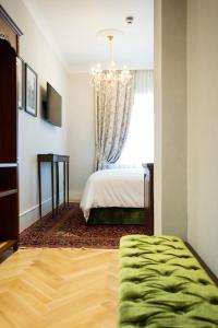 Postel nebo postele na pokoji v ubytování Ebel Boutique Hotel