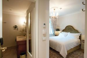 Postel nebo postele na pokoji v ubytování Ebel Boutique Hotel
