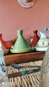 a group of vases sitting on top of a table at Dar HAJAR in Marrakech