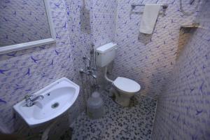 A bathroom at Le Apex Home Stay
