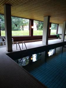 a swimming pool in a building with water in it at Ferienwohnung Rita in Freudenstadt