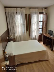 Ein Bett oder Betten in einem Zimmer der Unterkunft Hosteria de Rafi