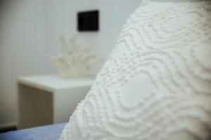A bed or beds in a room at Moderno Loft a 150 metros de la playa