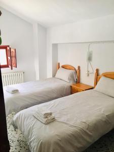 Posteľ alebo postele v izbe v ubytovaní CORTIJO VIANA LA SAGRA
