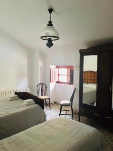 Posteľ alebo postele v izbe v ubytovaní CORTIJO VIANA LA SAGRA + 29 fotografií