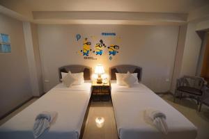 Postel nebo postele na pokoji v ubytování BCP Hotel