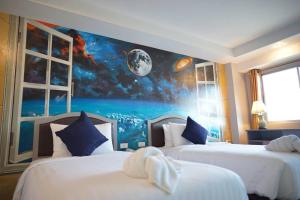 Postel nebo postele na pokoji v ubytování BCP Hotel