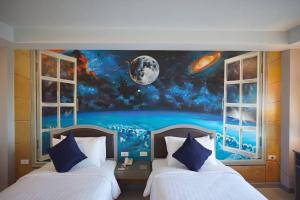 Postel nebo postele na pokoji v ubytování BCP Hotel