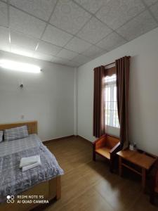 Postel nebo postele na pokoji v ubytování An Ngọc Linh Hotel