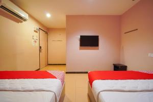 Postel nebo postele na pokoji v ubytování CMN Hotel & Homestay