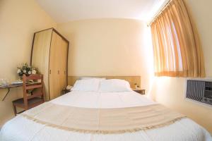 Ein Bett oder Betten in einem Zimmer der Unterkunft Antico Plaza Hotel