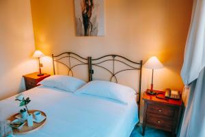 Postel nebo postele na pokoji v ubytování Hotel La Contrada