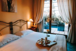 Postel nebo postele na pokoji v ubytování Hotel La Contrada