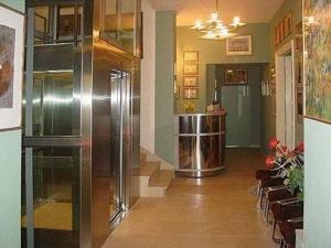 a lobby with a large refrigerator in a building at Hotel Alef in Kraków