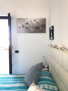 Postel nebo postele na pokoji v ubytování Domus Afrodite