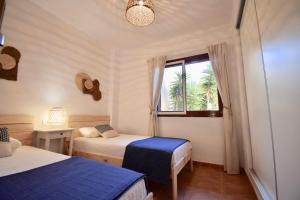 Posteľ alebo postele v izbe v ubytovaní Bahia Marinas - Tu hogar con jardín privado!