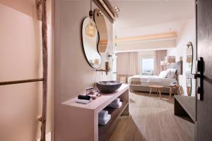 Cama ou camas em um quarto em Palladium Hotel
