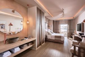 Cama ou camas em um quarto em Palladium Hotel