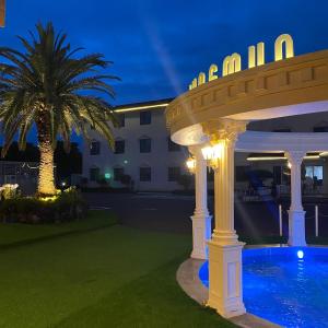 a villa with a swimming pool at night at Jungmun Resort Jeju in Seogwipo