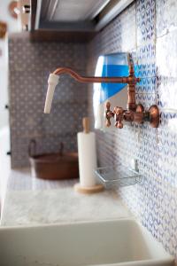 a bathroom sink with a faucet on a counter at B&B Cinisi Vacanze in Cinisi