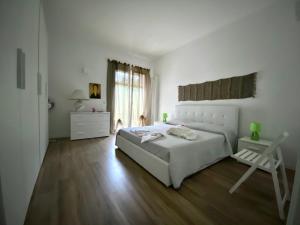 Un pat sau paturi într-o cameră la Villa "Le Giare"