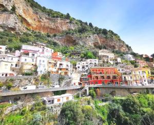 a group of houses on a mountain with a bridge at Villa Stella del mare in Positano