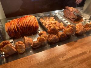 a buffet of food with meat and other foods at The Windmill Inn in Watchet