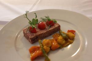 a white plate with a piece of food on it at The Windmill Inn in Watchet