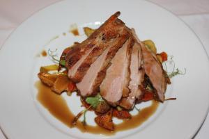 a plate of food with a piece of meat on top at The Windmill Inn in Watchet