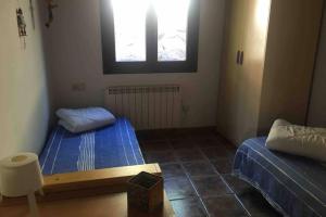 Posteľ alebo postele v izbe v ubytovaní LES MARMOTES Camprodon