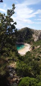 a view of a beach with people in the water at Villa Fredi in Orikum