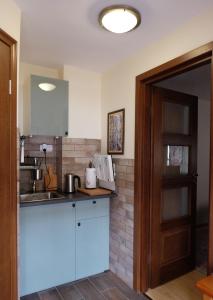 a kitchen with a sink and a counter top at Lublin Apartaments in Lublin