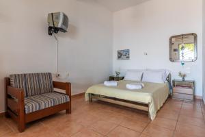 Posteľ alebo postele v izbe v ubytovaní Servani Studios & Suites