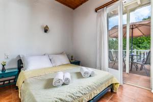 Posteľ alebo postele v izbe v ubytovaní Servani Studios & Suites