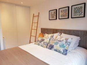 Ein Bett oder Betten in einem Zimmer der Unterkunft Gîte de Beg Menez Le 26 - Gîte à La Forêt-Fouesnant