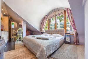Posteľ alebo postele v izbe v ubytovaní Apartamenty Kurort