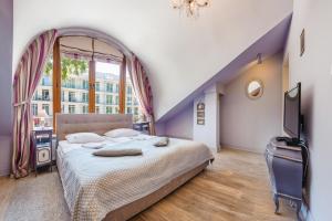 Posteľ alebo postele v izbe v ubytovaní Apartamenty Kurort